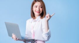 Image of young Asian businesswoman on blue background